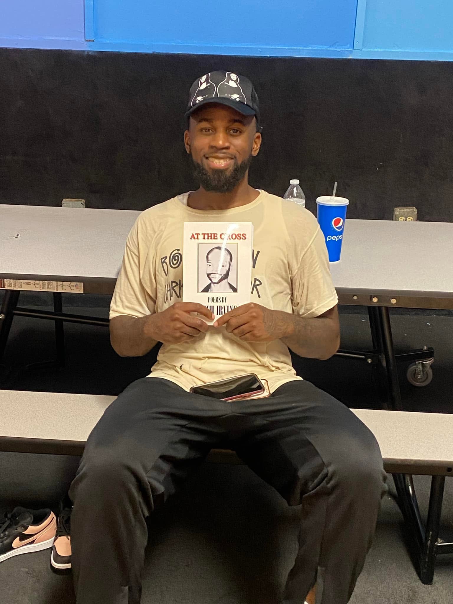 Reader holding Seth Irving's book