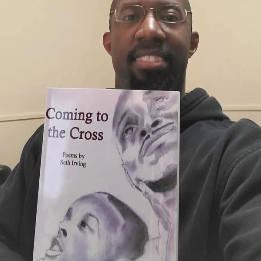 Reader holding Seth Irving's book